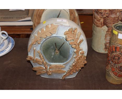 A Bernard Rooke pottery mantel clock with dragon fly and oak leaf decoration 