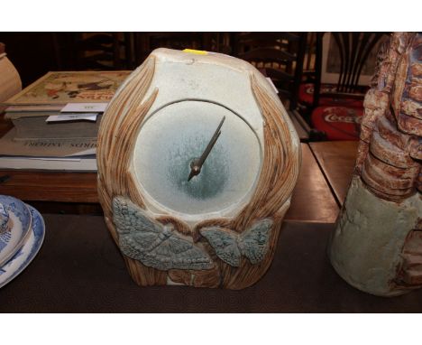 A Bernard Rooke pottery mantel clock with dragonfly, butterfly and reed decoration