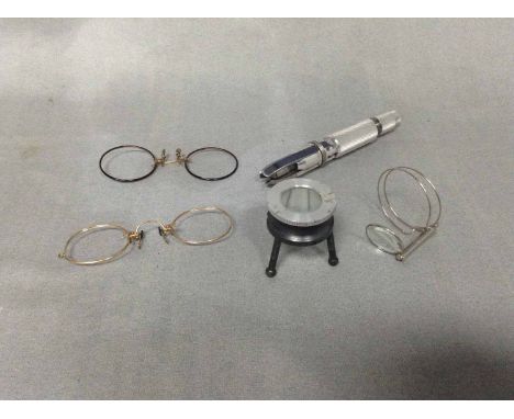 MAGNIFYING LOUPESalong with a pince nez and pipe reamer
