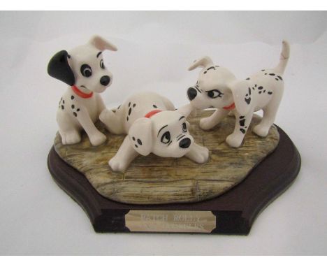 A Royal Doulton limited edition Disney's 101 Dalmatians - Patch, Rolly and Freckles, with certificate and stand, model no. DM