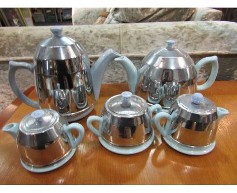 A 1960's retro teaset, blue ceramic with metallic covers