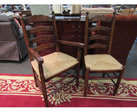 A set of ten (8+2) 18th Century style oak ladder back dining chairs with rush seats