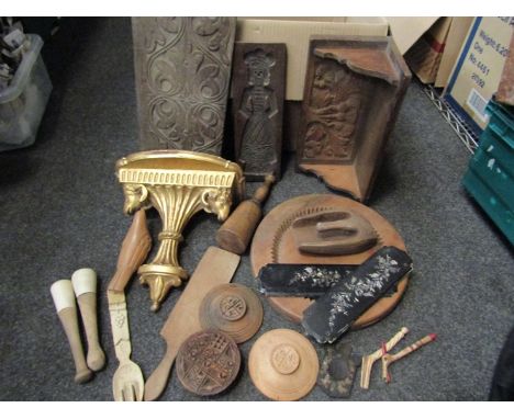 A box of treen and carved wooden items including gilded wall bracket, kitchen tools, carved oak bracket and panel etc