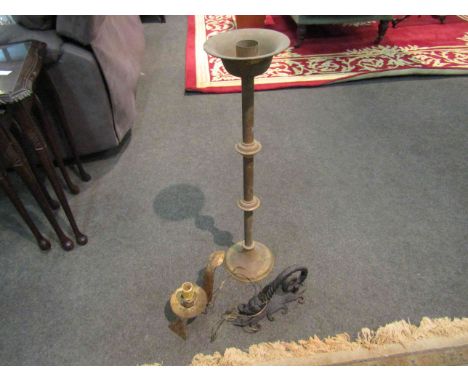 A gilt electric desk light, a wrought iron door knocker in the form of a dragon and tall brass candlestick       