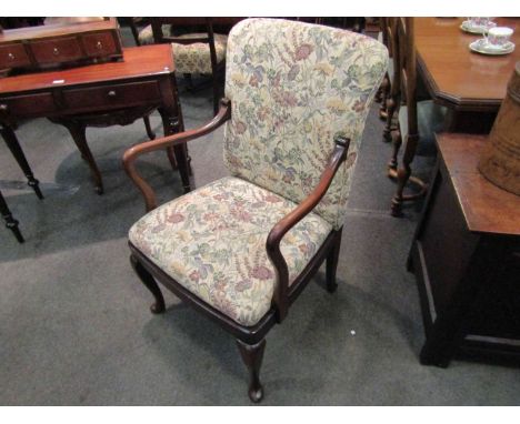 An Edwardian open arm desk chair with floral tapestry upholstery on cabriole legs   
