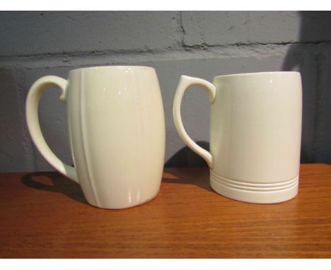 Two white glazed ceramic mugs designed by Keith Murray for Wedgwood, 12cm and 13cm high 