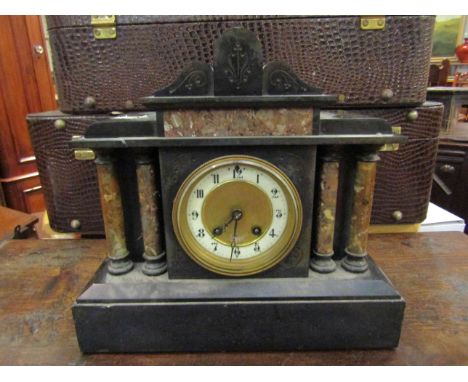 A Victorian black slate mantel clock of architectural form, French striking movement 