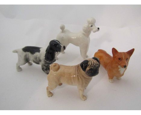 Four Beswick small dogs - White Poodle, model no. 2339, Corgi, model no. 1736, Pug, model no. 1998 and Cocker Spaniel, model 