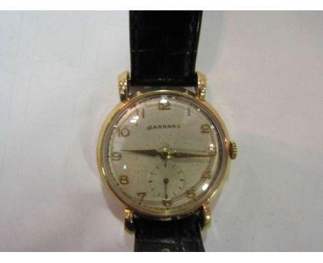 A 1960's Garrard gentleman's gold wristwatch, silvered dial with sweep second dial, teardrop lugs, inscribed to case back