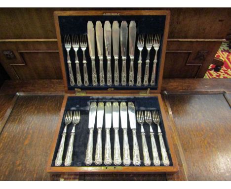 A canteen of plated fish knives and forks, one fork missing
