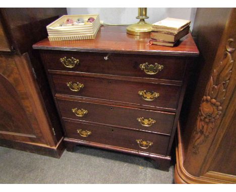 A 19th Century mahogany chest of small proportions, the reeded edge top over four graduating long drawers over bracket feet, 