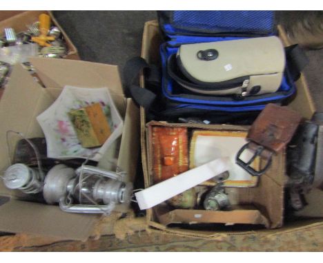 Two boxes of mixed items including mottled light shade, horse brass on leather strap, mixed china, photographic lenses etc
