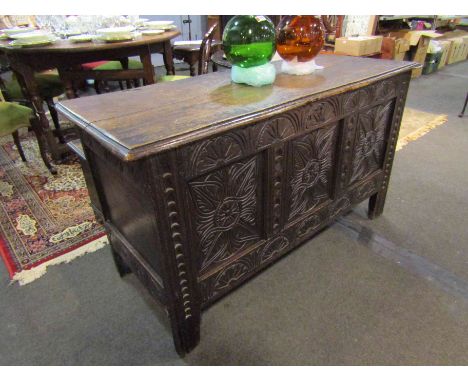 A 17th Century carved oak three panel coffer. 138cm wide x 77cm tall x 56cm deep
