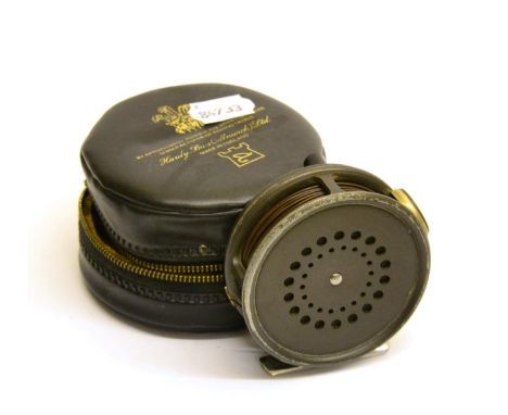 A Hardy 3 3/8inch Alloy 'The Perfect' Fly Reel, with alloy foot, black handle, agate line guard, grey enamel finish, in zip c