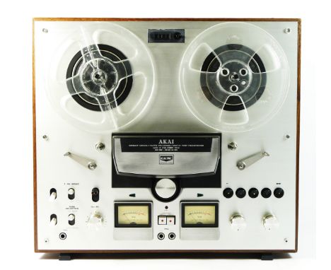 A Akai GX-265D stereo reel to reel, includes empty reels and manual 