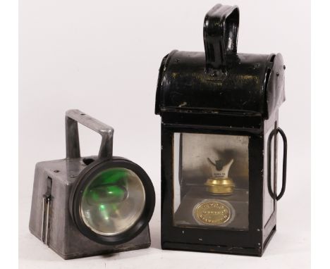 A L.M.S. hand lantern, complete with burner which has a brass plaque "L.M.S.R. Makers Wolverton, one glass cracked, together 
