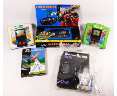 Five handheld and tabletop electronic games, to include Computerized Golf Master 2 by Systema, a TV Boy II (contains 126 game