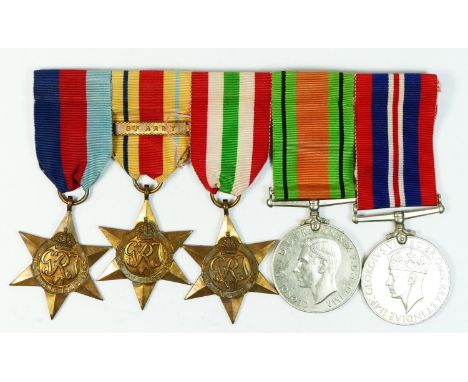WWII mounted group of five, 1939-1945 Star, Africa Star with 8th Army bar, Italy Star, Defense and War. 