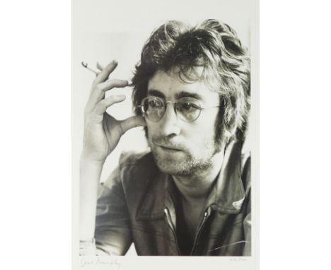 A portrait of John Lennon, from The Legends Collection, number 476 of 750, signed in pencil by photographer Spud Murphy, 35.5