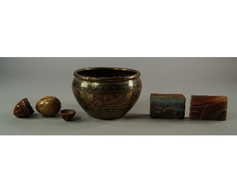 A coquilla nut egg form box, 19th century, overall pierced with holes, (a/f), 6.5cm high, a brown agate egg, an Indian brass 