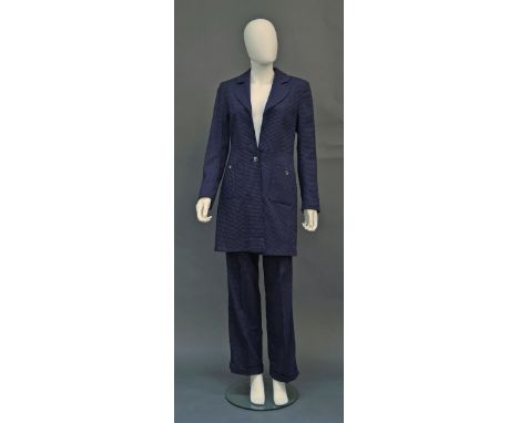 A Biba trouser suit, of purple wool/polyester, the long-line jacket with front patch pockets, the trousers with turn-ups, lab