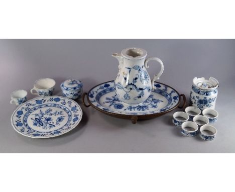 A part Meissen blue and white part dinner service, together with other porcelain/pottery wares of similar design from other m