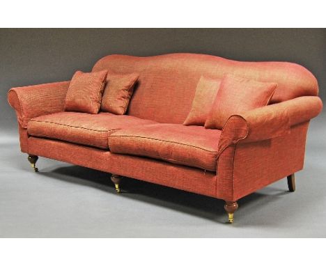 A pink upholstered three seater sofa, raised on mahogany style legs.   CONDITION REPORT: firm upholstery, generally good colo