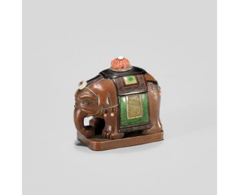 DOSHO: A SHIBAYAMA-INLAID WOOD NETSUKE OF A CAPARISONED ELEPHANTBy Dosho, signed Dosho 道笑Japan, late 19th century, Meiji peri