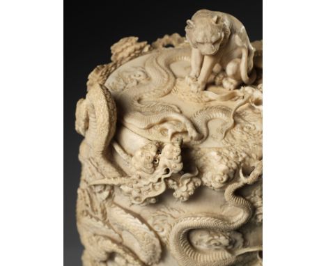 A SUPERB AND LARGE IVORY TUSK BOX AND COVER DEPICTING A TIGER AND DRAGONSUnsignedJapan, late 19th century, Meiji period (1868