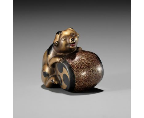 A CHARMING GOLD LACQUER NETSUKE OF A DOG WITH DRUMUnsignedJapan, 19th centuryA charming netsuke, depicting a gold-lacquered p