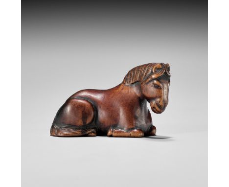A WOOD NETSUKE OF A RECUMBENT HORSEUnsigned Japan, late 18th to early 19th century, Edo period (1615-1868)Well carved with th