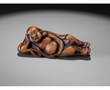 AN EARLY WOOD NETSUKE OF A RECLINING HOTEIUnsignedJapan, 18th century, Edo period (1615-1868)An old and pleasingly tactile ne