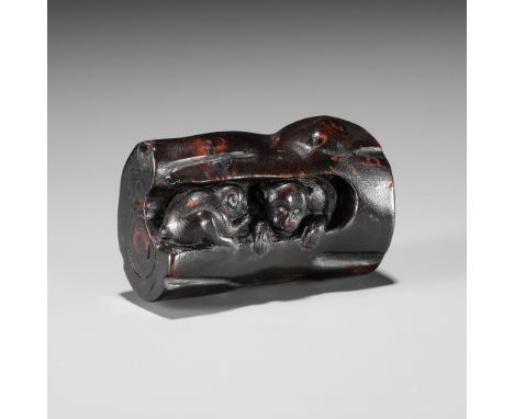 A RARE UMIMATSU NETSUKE OF THREE MONKEYS INSIDE A TREEUnsignedJapan, 18th-19th century, Edo period (1615-1868)Carved from a c