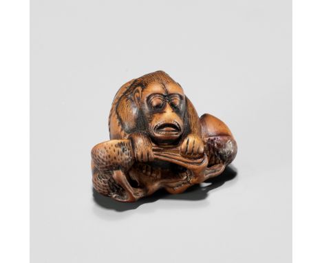 A KYOTO SCHOOL WOOD NETSUKE OF A MONKEY WITH ACORNSUnsignedJapan, Kyoto, early 19th century, Edo period (1615-1868)Expressive