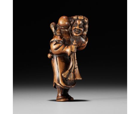 A WOOD NETSUKE OF A DUTCHMAN WITH CHILDUnsignedJapan, 18th century, Edo period (1615-1868)Typically depicted with shoulder-le