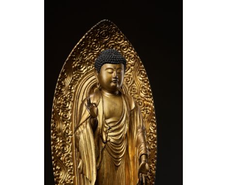 A GILT WOOD FIGURE OF AMIDA NYORAIJapan, 18th-19th century, Edo period (1615-1868)Amida standing on a lotus dais raised on a 