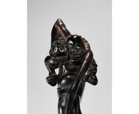 A TALL EBONY WOOD NETSUKE OF ASHINAGA AND TENAGAUnsignedJapan, late 18th to early 19th century, Edo period (1615-1868)A tall 