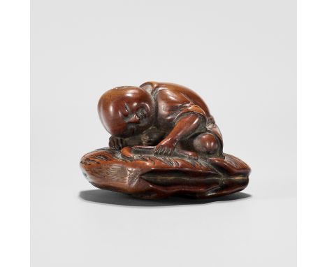 A CHARMING WOOD NETSUKE OF A SLEEPING FARMERUnsignedJapan, late 18th century, Edo period (1615-1868)A charming wood netsuke o