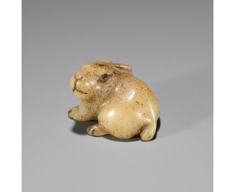 A CHARMING STAG ANTLER NETSUKE OF A HAREUnsignedJapan, 19th century, Edo period (1615-1868)The rabbit (usagi) seated with its