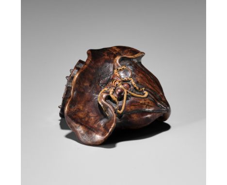 IKKOKUSAI: A RARE TAKAMORIE LACQUERED WOOD NETSUKE OF A WASP AND LOTUSBy Ikkokusai, signed Ikkokusai 一谷齋Japan, late 19th cent