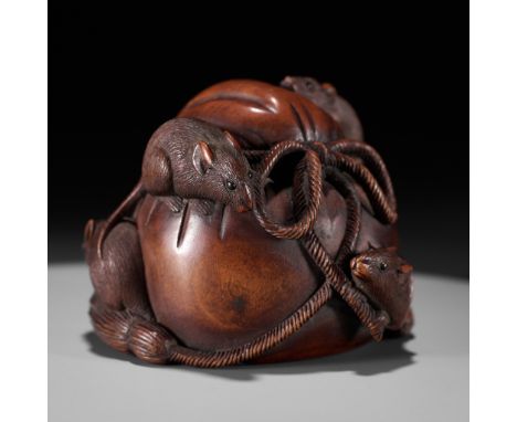 IKKO: A WOOD OKIMONO NETSUKE OF FIVE RATS AROUND DAIKOKU'S TREASURE BAGBy Ikko, signed Ikko 一光Japan, late 19th century, Meiji