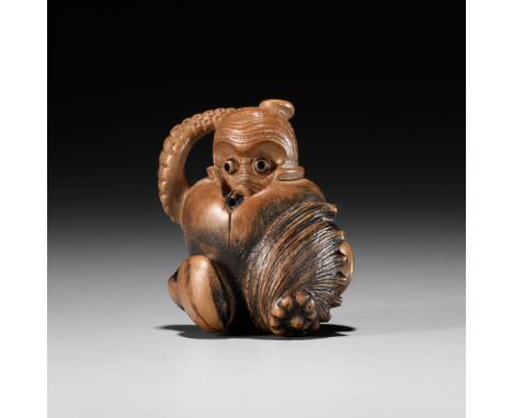 TOMONOBU: A STAINED WOOD NETSUKE OF A TRAPPED OCTOPUS (TAKO TSUBO)By Arima Tomonobu, signed Tomonobu 友信Japan, Nagoya, 19th ce