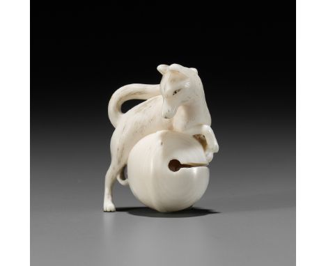 RANTEI: A FINE IVORY NETSUKE OF A FOX WITH TEMPLE BELLBy Hogen Rantei, signed Rantei 蘭亭Japan, Kyoto, early 19th century, Edo 