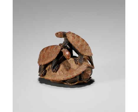 SHOKIN: A WOOD NETSUKE OF THREE TURTLES IN A PYRAMIDBy Shokin, signed Shokin 松琴Japan, 19th centuryOf compact form and finely 