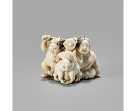 AN IVORY NETSUKE OF KINTARO AND YAMAUBA WATCHING TWO RABBITS WRESTLEUnsigned Japan, Tokyo, late 19th centuryFinely and charmi