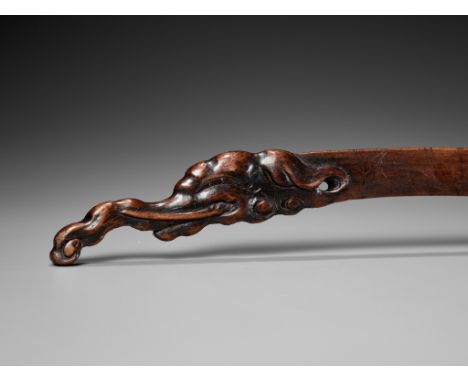 A RARE WOOD BOKUTO ('DOCTOR'S SWORD') WITH BAKU HEADJapan, 18th-19th century, Edo period (1615-1868)The handle carved in the 