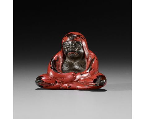 A NEGORO LACQUER NETSUKE OF DARUMAUnsignedJapan, Meiji period (1868-1912)Bodhidharma is shown seated meditatively, completely