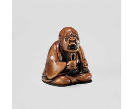 AN AMUSING EDO SCHOOL WOOD NETSUKE OF A MAN PLUCKING HIS BEARDUnsigned Japan, Edo (Tokyo), 19th century, Edo period (1615-186