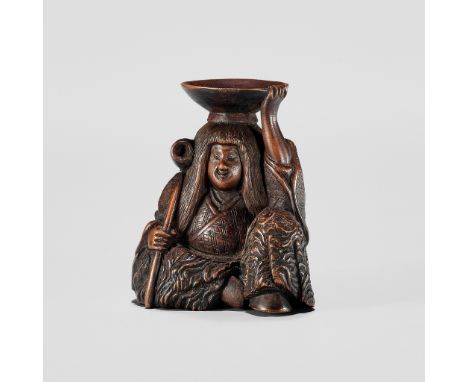 HIDEHARU: A NAGOYA SCHOOL WOOD NETSUKE OF A DRUNKEN SHOJO WITH LADLE AND SAKE SAUCERBy Hideharu, signed Hideharu 秀晴Japan, Nag