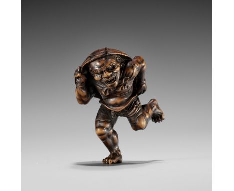 A WOOD NETSUKE OF AN ONI AT SETSUBUN, ATTRIBUTED TO ROKKOUnsignedJapan, Tokyo, late 19th century Well carved as a muscular on